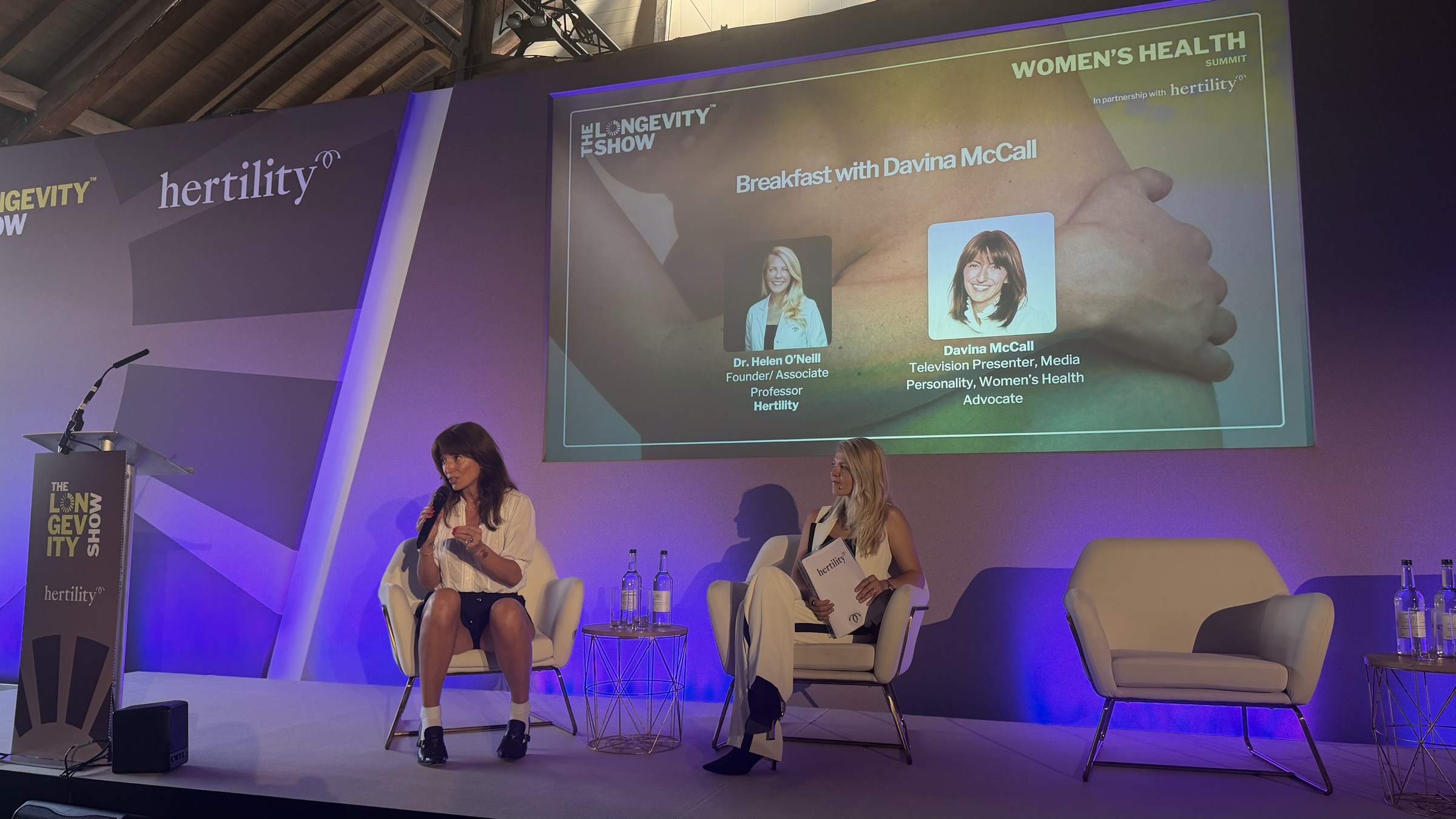 Davina McCall and Dr Helen O'Neill in warm conversation at The Longevity Show, Tobacco Dock, London, June 2026